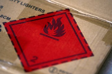 Flammable material warning on shipping carton clipart