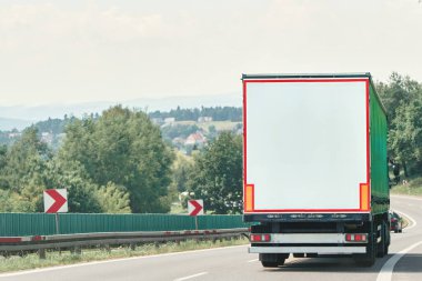 Transport truck on a curvy highway road clipart