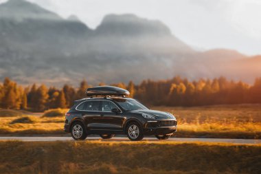 Luxury Black SUV with Roof Rack for Family Road Trips clipart