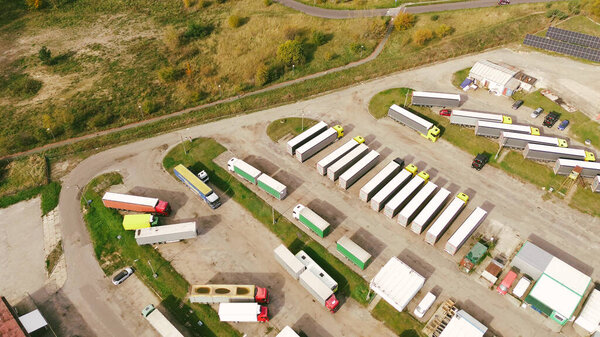 Trucks and trailers parked at depo