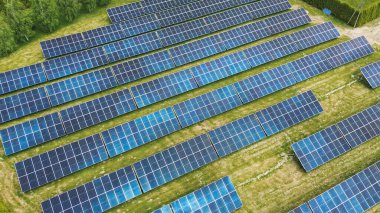 Drone view of solar farm at sunset Solar panels producing power