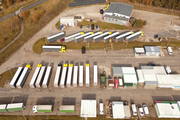 Truck fleet parked at warehouse facility