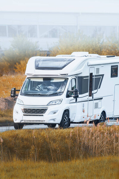 RV driving through scenic Alps during summer