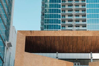 Wooden facade and highrise building in Charlotte, NC clipart