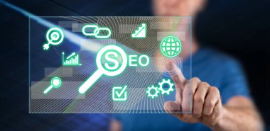 Bir adam dokunmatik ekranda bir konsepte parmağıyla dokunuyor.