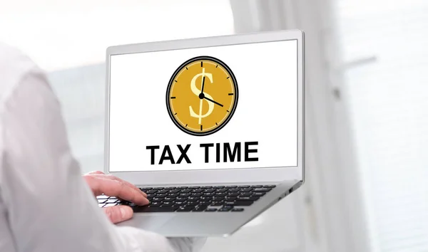 Laptop screen displaying a tax time concept