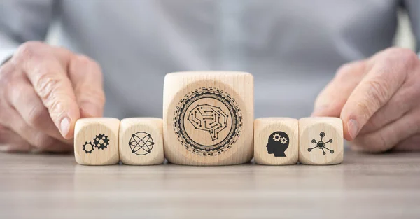 Wooden blocks with symbol of machine learning concept