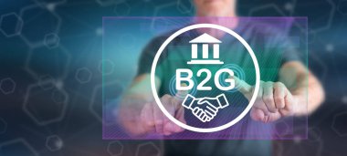 Adam dokunmatik ekranda parmaklarıyla b2G konseptine dokunuyor.