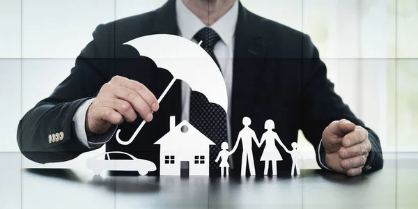 stock image General agent protecting a family, a house and a car with his hands, geometric pattern