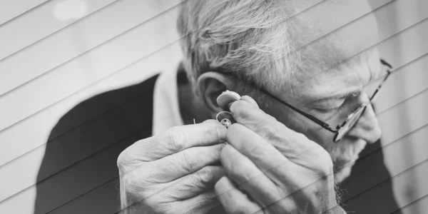 Senior Man Putting Hearing Aids Geometric Pattern — Foto Stock