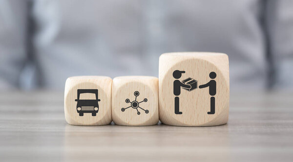 Wooden blocks with symbol of dropshipping concept