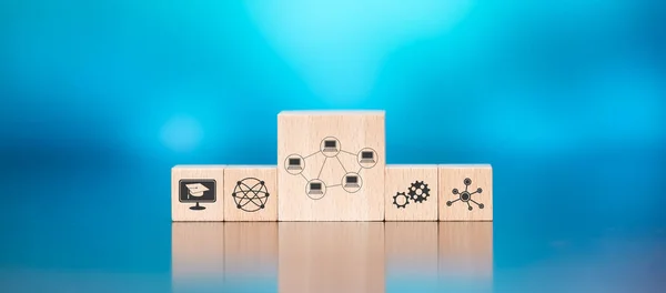 Wooden blocks with symbol of webinar concept on blue background