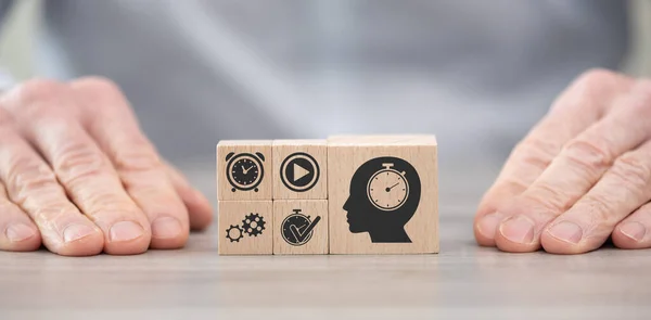 Wooden blocks with symbol of time management concept