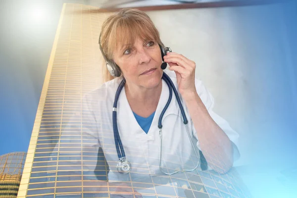 Portrait of mature female doctor during online medical consultation; multiple exposure