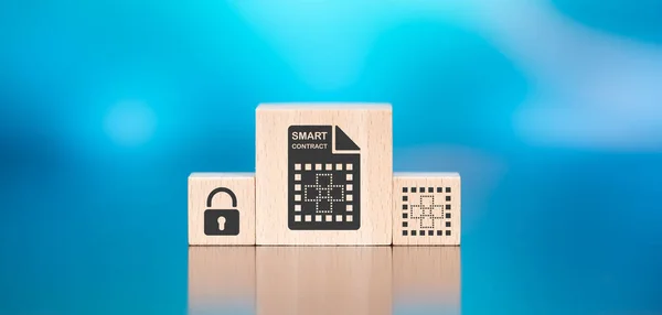 Wooden blocks with symbol of smart contract concept on blue background