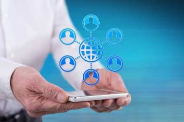 Globalization concept above a smartphone held by hands
