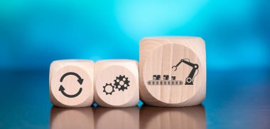 Mavi arkaplanda otomasyon sembolü olan tahta bloklar