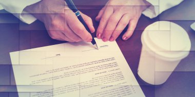Hand of businesswoman signing a contract (lorem ipsum text used), geometric pattern