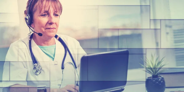 Portrait of mature female doctor during online medical consultation, geometric pattern