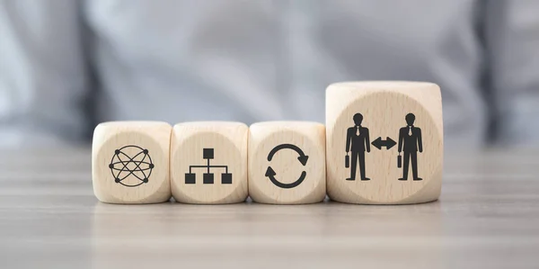 stock image Wooden blocks with symbol of business transition concept