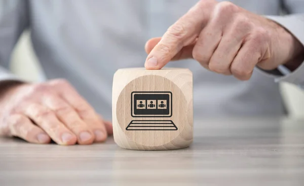 Wooden block with symbol of webinar concept