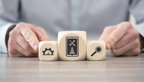 Wooden blocks with symbol of system maintenance concept