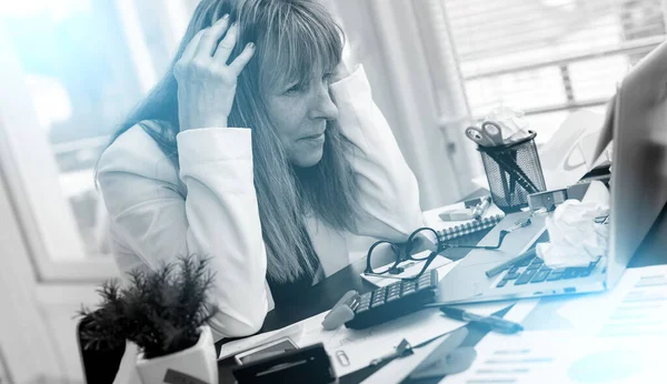Overworked Mature Businesswoman Sitting Messy Desk Light Effect — Fotografia de Stock