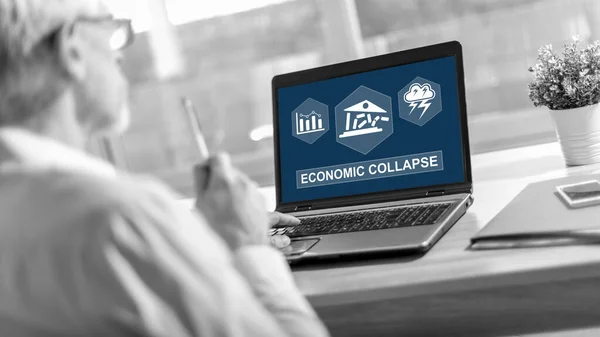 Laptop screen displaying an economic collapse concept