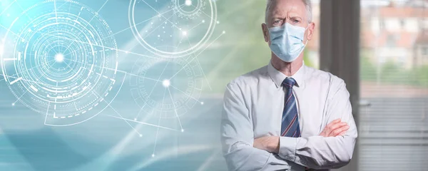 stock image Portrait of senior businessman with arms crossed wearing a face mask; panoramic banner