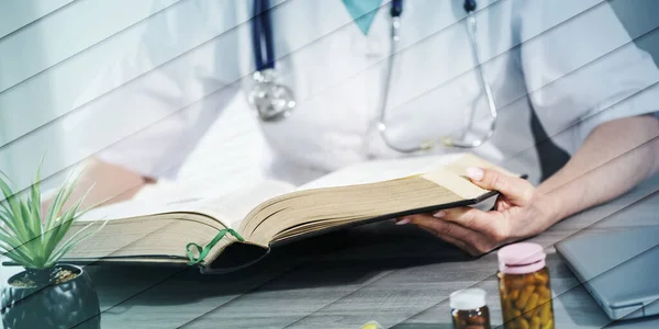 Female Doctor Reading Textbook Medical Office Geometric Pattern — 스톡 사진