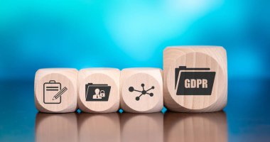 Wooden blocks with symbol of gdpr concept on blue background