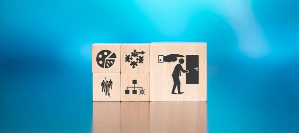 Wooden blocks with symbol of job loss concept on blue background