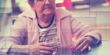 Elderly woman taking her medicine at home, geometric pattern