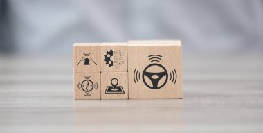 Wooden blocks with symbol of self-driving car concept