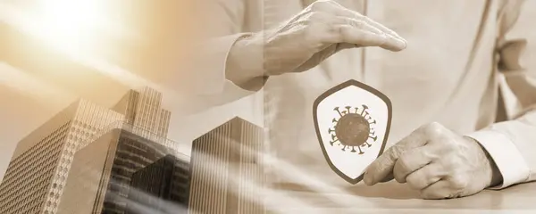Man holding a shield with virus; concept of prevention and virus protection; multiple exposure