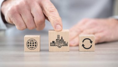 Wooden blocks with symbol of m&a concept clipart