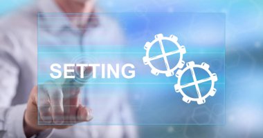 Bir adam dokunmatik ekranda bir konsepte parmağıyla dokunuyor.