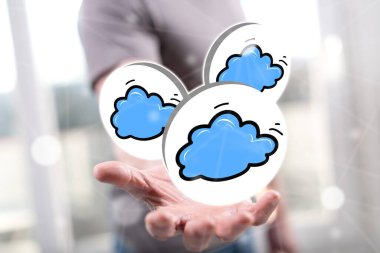 Bulut ağı kavramı arka plandaki adamın elinin üstünde.