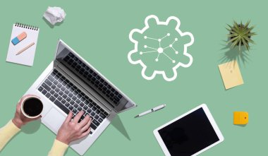 Top view of hands using laptop with symbol of network management concept