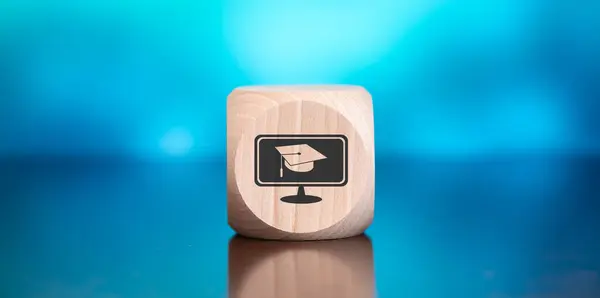 stock image Wooden block with symbol of mooc concept on blue background