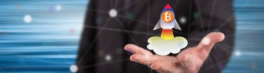 Bitcoin yükselişi kavramı içinde geçmiş bir adamın elini yukarıda