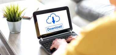 Bir veri indirme kavramını gösteren dizüstü bilgisayar