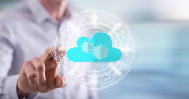 İnsan dokunmatik ekranda bulut teknolojisi konseptine parmağıyla dokunuyor.