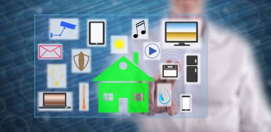 Adam dokunmatik ekranda akıllı bir ev kavramına parmağıyla dokunuyor.