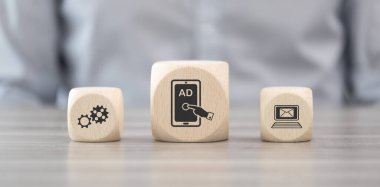 Wooden blocks with symbol of advertising concept