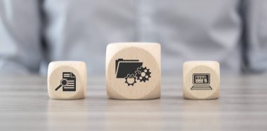 Wooden blocks with symbol of document management concept