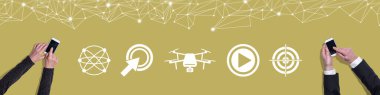 Top view of hands using mobile phone with symbol of drone concept