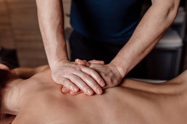 Male Masseur Doing Back Massage Client Woman Dark Room Massage Stock Kép