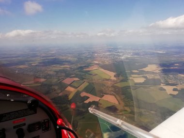  Airplane in flight, view from the plane to the ground..
