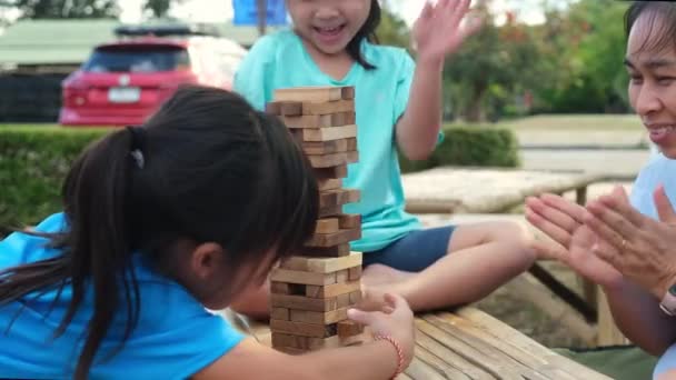 Excited Kids Mom Playing Jenga Tower Wooden Block Game Together — Video